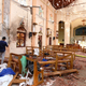 Sri Lankan officials inspect St. Sebastian’s Church in Negombo, north of Colombo, after multiple explosions targeting churches and hotels across Sri Lanka.